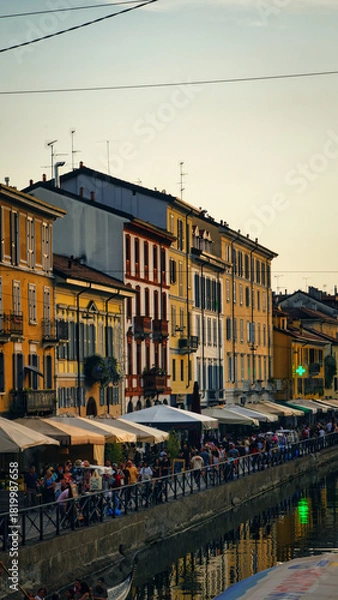 Obraz Canal in Milan, Italy, glowing in warm sunset light