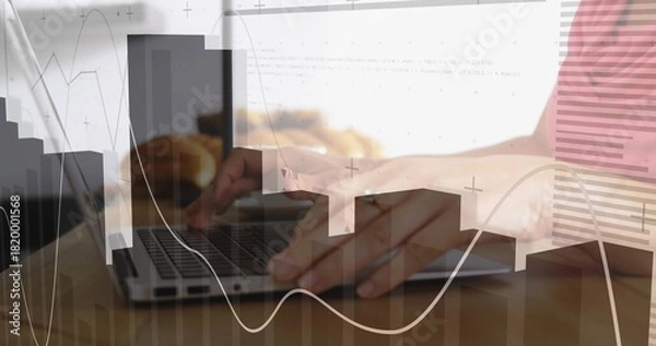 Fototapeta Typing person's hands with ring pressing laptop keys on wooden table, cup, charts, striped top