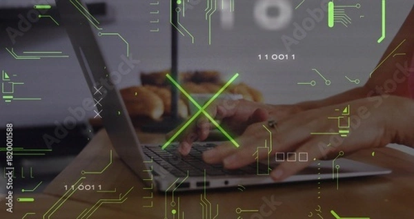 Fototapeta Typing hands pressing keys on clamshell laptop in home kitchen, with ring, pastries, green HUD