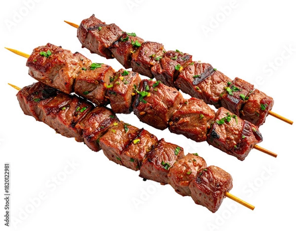 Fototapeta Three skewers of grilled, browned meat, garnished with chopped herbs, on a black background