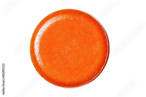 Fototapeta Glossy orange button with faint sparkle isolated on black