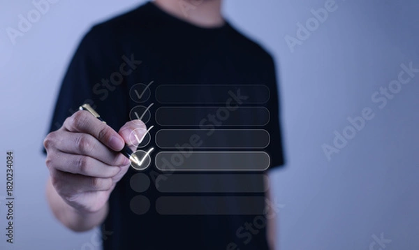 Fototapeta 
Man checking checkboxes, business performance checklist concept, survey, ticking checklist, filling out online forms, document management system, DMS, performance appraisal