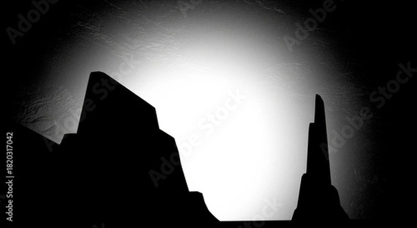 Obraz Dramatic Black and White Desert Landscape Silhouette with Towering Rock Formations and Brilliant Backlight