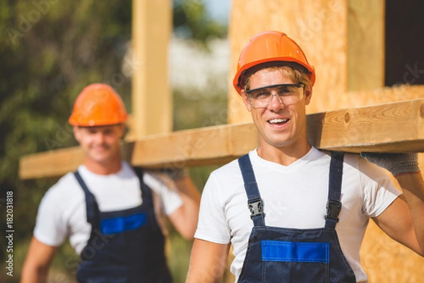 Obraz Two man building wooden house