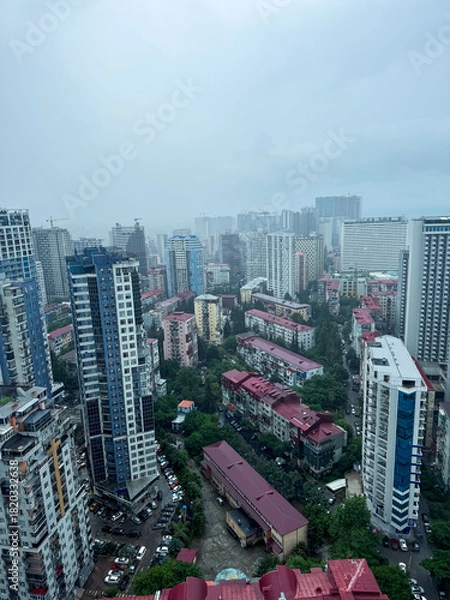 Obraz City skyline view of residential buildings and urban life during a cloudy day in Lagos, Nigeria
