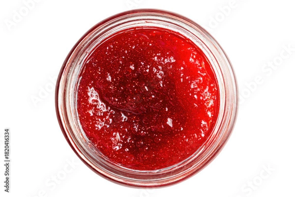 Fototapeta Close overhead view of thick red preserve in a clear glass jar
