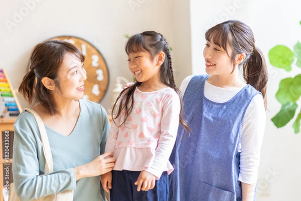 Obraz 保育士と親子のポートレート