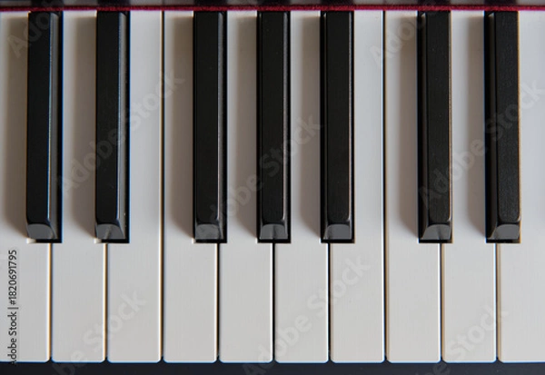 Fototapeta Close up of piano keys, partially shown