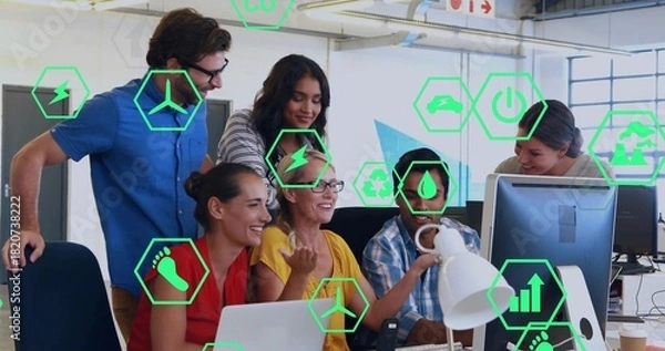 Obraz Gathering six coworkers at monitor and laptop in office in casual attire, showing green AR-icons