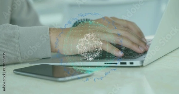 Obraz Typing hands wearing light top with wrist watch on home desk, silver laptop, phone, globe overlay