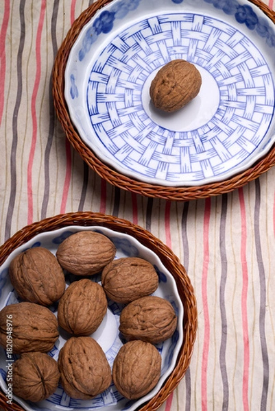 Fototapeta nuts in an earthenware basket