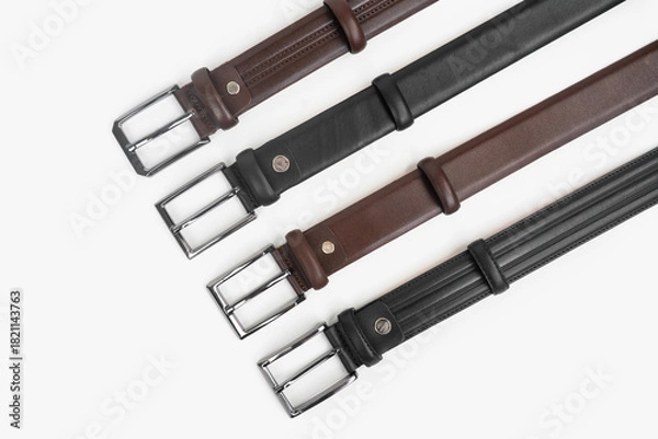Obraz Leather Belts in Row on White Background