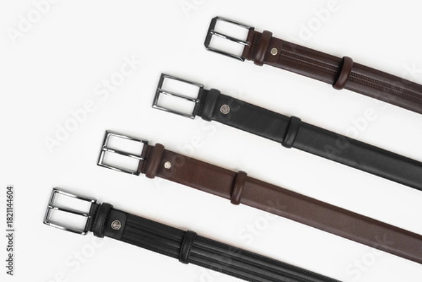 Obraz Leather Belts in Row on White Background