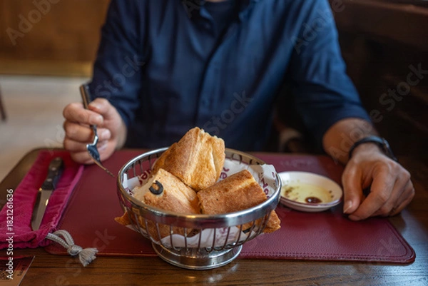 Obraz Man Dining with Fresh Bread Basket
