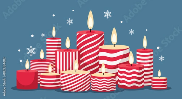 Fototapeta A festive collection of various red and white striped candles with burning flames, scattered snowflakes, and a cool blue background, symbolizing winter holidays.