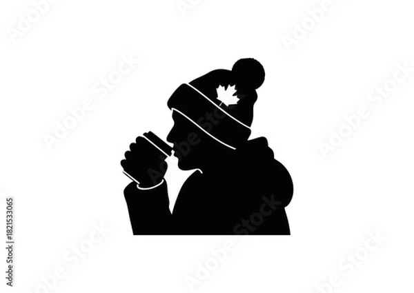 Fototapeta Silhouette of a Person Drinking Hot Beverage in Winter Attire, with a Maple Leaf on Hat