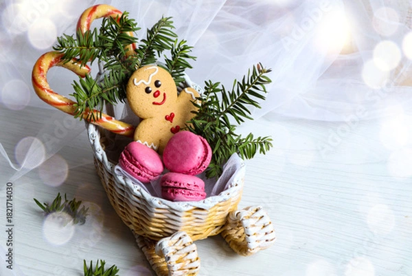 Obraz A New Year's sleigh with Christmas sweets on a white background with bokeh and space for text