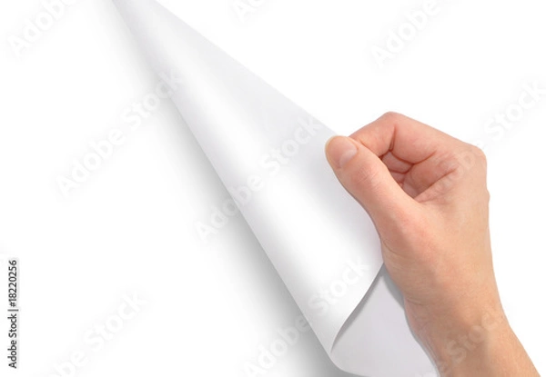 Obraz A hand is turing a white piece of paper