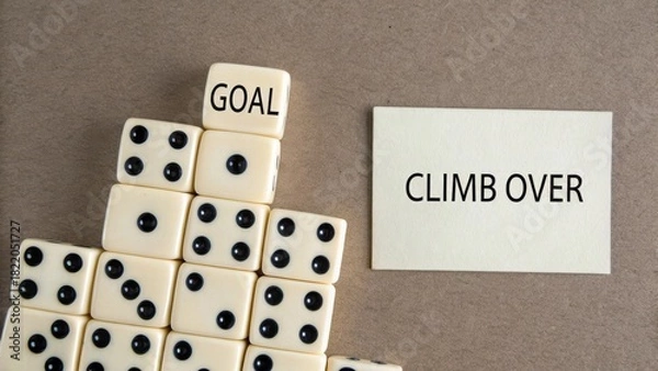 Fototapeta Domino pyramid with 'Goal' on top and 'Climb' card representing the journey to success