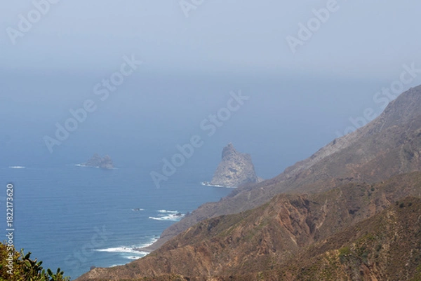 Fototapeta Anaga is a mountain range with sharp edges and deep ravines, covered in a green blanket of laurel forest. It is a protected natural area in Tenerife, Canary Islands, Spain.