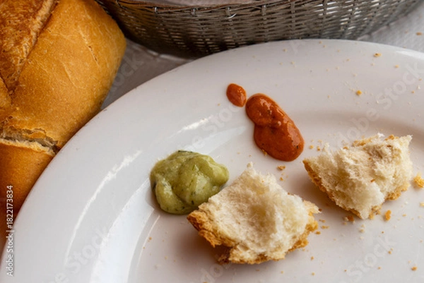 Fototapeta Mojo is a typical sauce from the Canary Islands and an accompaniment to some traditional dishes. Green mojo is prepared with green peppers, and parsley Red mojo is made with pepper and paprika 