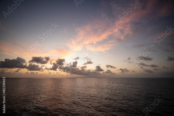 Fototapeta Images of a sunset in the middle of the Atlantic Ocean, crossing from the Canary Islands to Salvador de Bahia in Brazil.