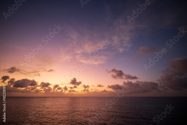 Fototapeta Images of a sunset in the middle of the Atlantic Ocean, crossing from the Canary Islands to Salvador de Bahia in Brazil.