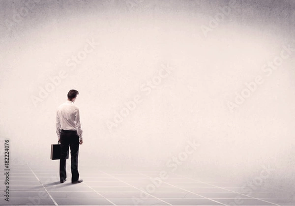 Fototapeta Business person standing in empty space