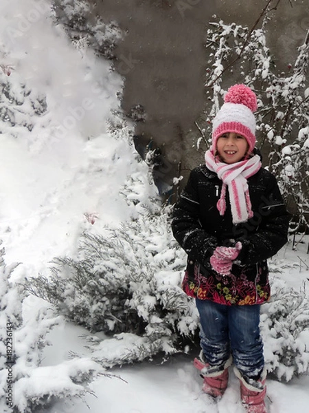 Fototapeta .A lot of snow, a child in the snow