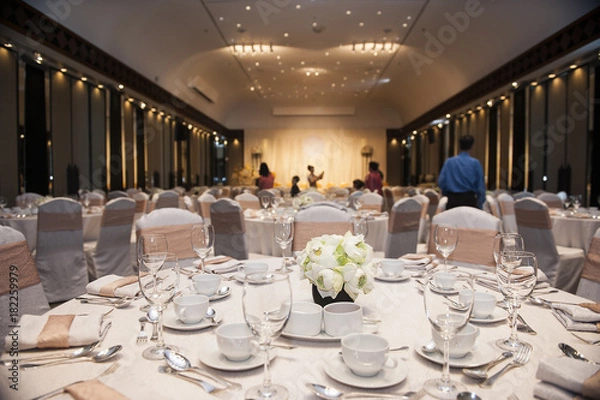 Fototapeta Table setup at dinner party, white and orange color theme