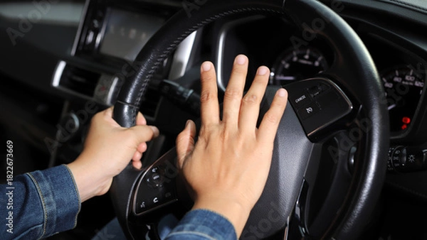 Fototapeta The driver is honking the horn to prevent an accident