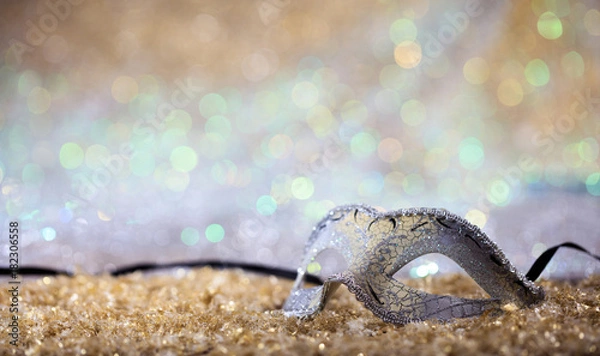 Fototapeta Silver carnival mask on bokeh background