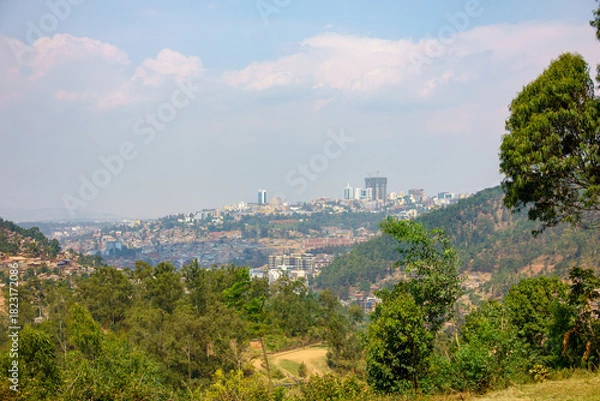 Fototapeta View through valley of urban skyline of African city