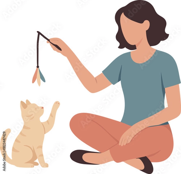 Obraz Woman playing with cat and feather toy