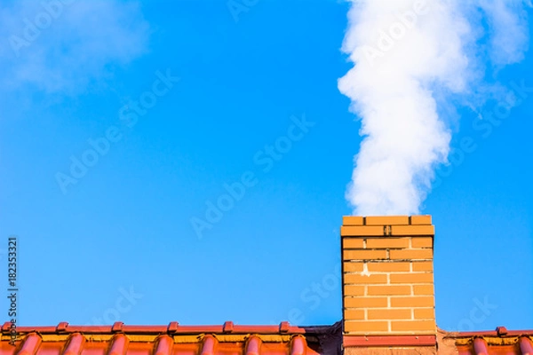 Obraz Modern house roof with chimney smoke, air pollution and smog in winter, ecological problems