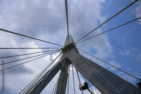 Obraz Cable-Stayed Bridge Pylon Viewed from Below Against Blue Sky
