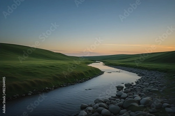Fototapeta A Casual Peaceful River Landscape with Rolling Green Hills at Sunset