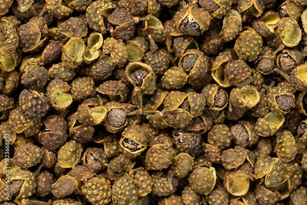 Fototapeta Pile of dried green szechuan peppercorns or chinese prickly for background. Top view