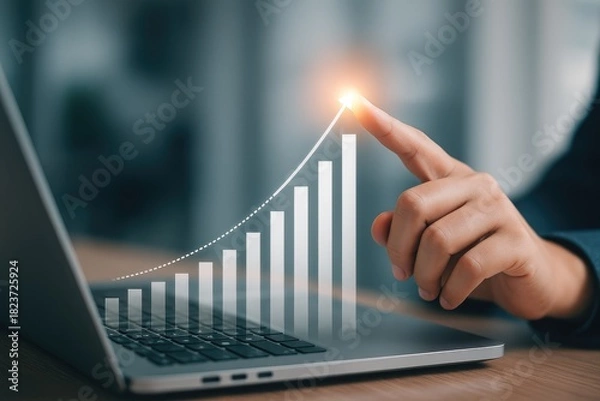 Fototapeta Positive financial growth trend visualization showing upward progress on a laptop screen.