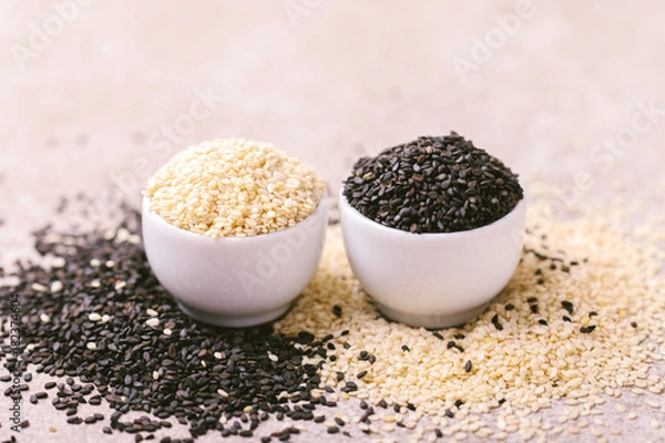 Fototapeta Black and white sesame seeds. Copy space. Horizontal view.
