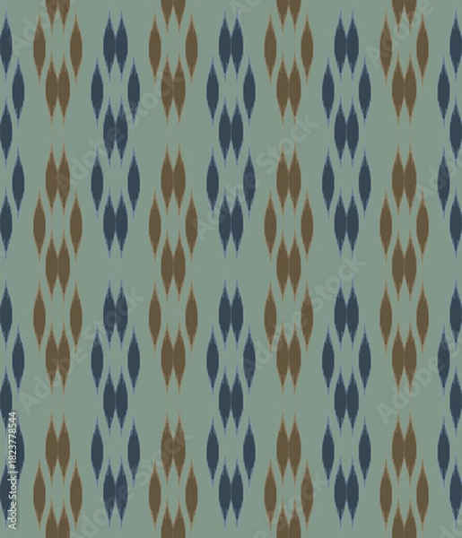 Fototapeta Traditional ikat mixed with modern style in teardrop shapes on  dark blue and brown seamless pattern background.