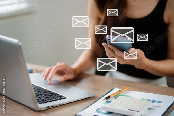 Fototapeta Email notification concept, Female use smartphone and laptop receive message alert in the mailbox.