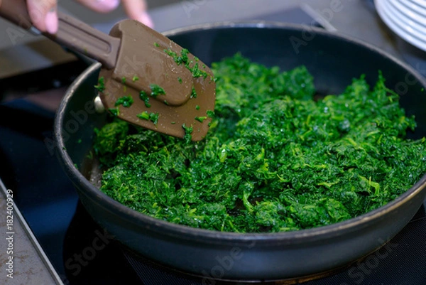 Obraz Close-up spinach in pan for sauce
