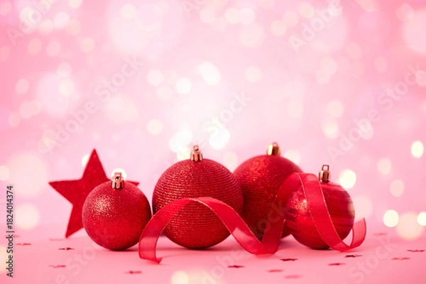 Obraz Red Christmas decorations on pink background