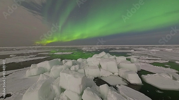 Obraz Spectacular Aurora Borealis Lights Dancing Over Arctic Ice Landscape