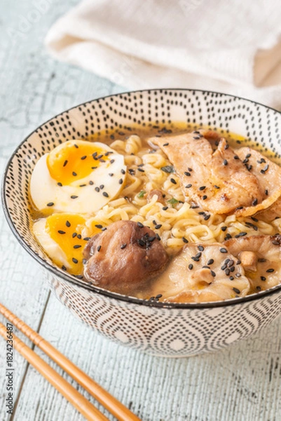 Fototapeta Bowl of ramen with pork belly, soft egg, and shiitake mushrooms
