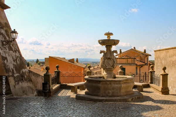 Fototapeta Fontana del Cardinale a Tuscania con acqua corrente e cielo