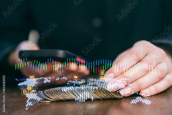 Obraz Financial planning using mobile technology for investment and budgeting during a business meeting