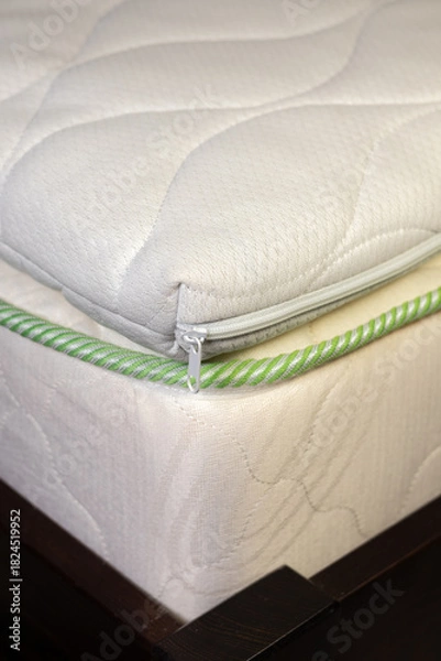 Obraz Mattress filled with coconut chips. Firm orthopedic mattress topper. Vertical photo.