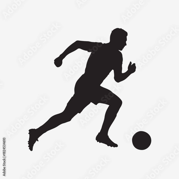 Fototapeta Silhouette of Soccer Player Running with Ball football